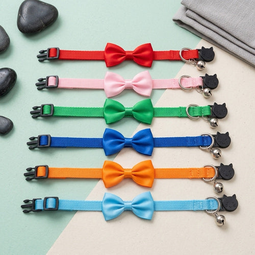 PawNoodle bow and bell cat collar shown in multiple colors